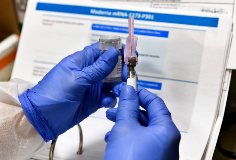 Registered Nurse Kath Olmstead prepares  a blinded study experimental vaccine for COVID-19 developed by the National Institutes of Health and Moderna Inc. at the United Health Services facility, Monday, July 27, 2020, in Binghamton, N.Y. (AP Photo/Hans Pennink