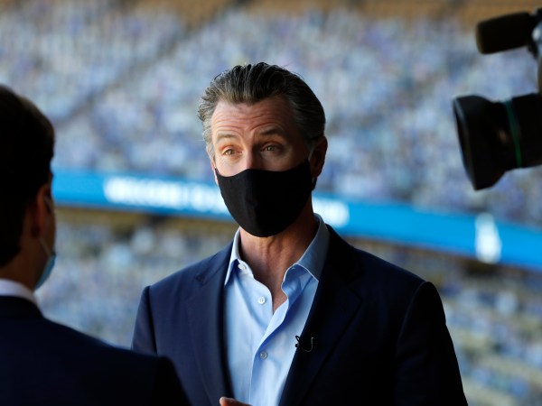 Los Angeles, California—Oct. 30, 2020—Gov. Gavin Newsom talks to the media after visiting Dodger Stadium on Oct. 30, 2020. (Carolyn Cole/ Los Angeles Times)