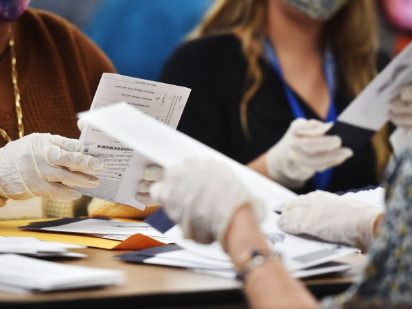 WILKES-BARRE, UNITED STATES - 2020/11/04: Luzerne County employees open mail-in ballots to be counted at the elections board in Wilkes-Barre.Pennsylvania mail-in ballots are being counted with about fifty thousand in total, Luzerne County hopes to finish tonight. Media is allowed to document the vote counting process in Pennsylvania. (Photo by Aimee Dilger/SOPA Images/LightRocket via Getty Images)