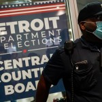 DETROIT, MI - NOVEMBER 04: A police officer stands at the entrance to the Detroit Department of Elections Central Counting Board of Voting absentee ballot counting center at TCF Center, Wednesday, Nov. 4, 2020 in Detroit, MI. With the surge in vote by mail/absentee ballots, analysts cautioned it could take days to count all the ballots, leading some states to initially look like victories for President Trump only to later shift towards democratic Presidential candidate Joe Biden.