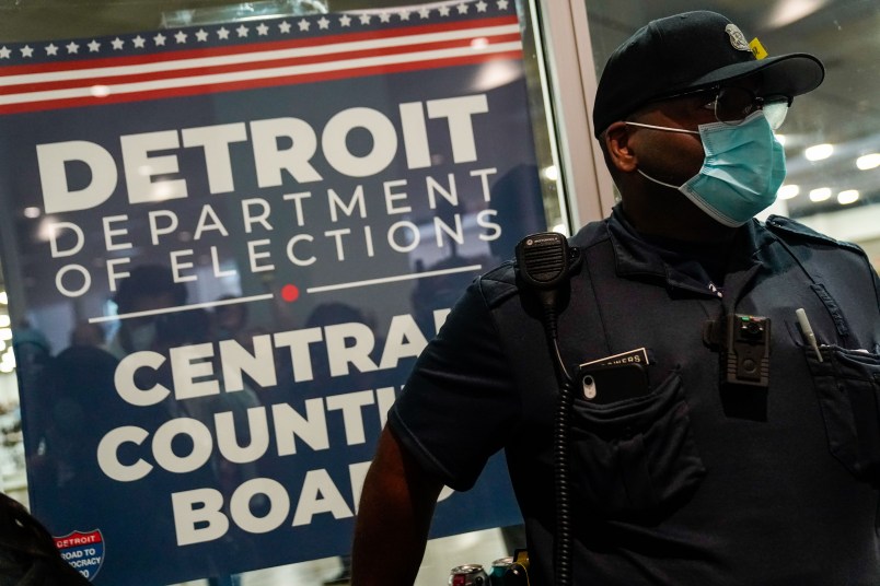 DETROIT, MI - NOVEMBER 04: A police officer stands at the entrance to the Detroit Department of Elections Central Counting Board of Voting absentee ballot counting center at TCF Center, Wednesday, Nov. 4, 2020 in Detroit, MI. With the surge in vote by mail/absentee ballots, analysts cautioned it could take days to count all the ballots, leading some states to initially look like victories for President Trump only to later shift towards democratic Presidential candidate Joe Biden.