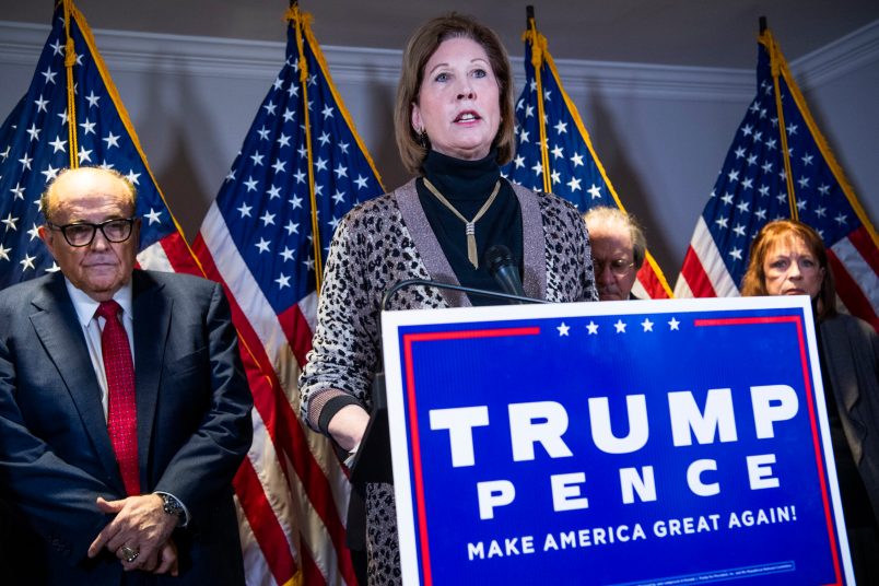 UNITED STATES - NOVEMBER 19: Sydney Powell, attorney for President Donald Trump, conducts a news conference at the Republican National Committee on lawsuits regarding the outcome of the 2020 presidential election on Thursday, November 19, 2020. Trump attorney Rudolph Giuliani, left, also attended. (Photo By Tom Williams/CQ Roll Call)