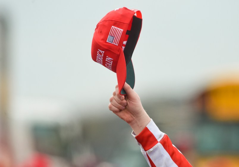 A supporter of President Donald J. Trump hold up their Make America Great Again hat. At the Reading Regional Airport in Bern Township, PA Saturday afternoon October 31, 2020 where United States President Donald J. Trump spoke during a campaign rally for his bid for reelection.