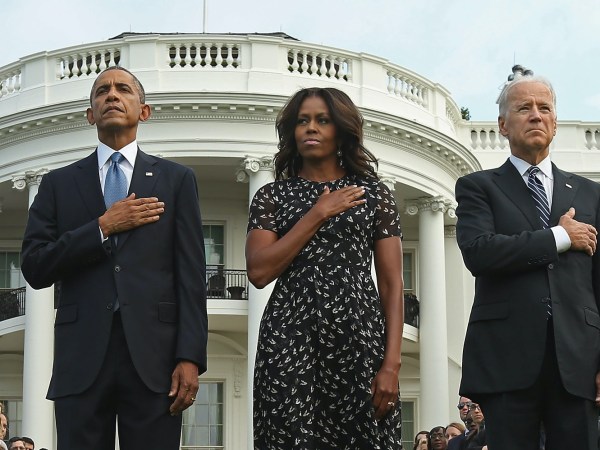 U.S. President Barack Obama, first lady Michelle Obama, Vice President Joe Biden and Dr. Jill Biden observe a moment of silence to mark the 13th anniversary of the 9/11 attacks September 11, 2014 in Washington, DC. Obama and the first lady will travel to the Pentagon later today for another memorial ceremony.