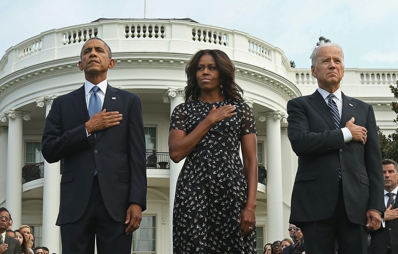 U.S. President Barack Obama, first lady Michelle Obama, Vice President Joe Biden and Dr. Jill Biden observe a moment of silence to mark the 13th anniversary of the 9/11 attacks September 11, 2014 in Washington, DC. Obama and the first lady will travel to the Pentagon later today for another memorial ceremony.