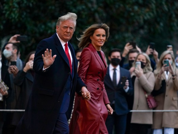President Donald Trump and first lady Melania Trump walk on the South Lawn of the White House in Washington, Saturday, Dec. 5, 2020, before boarding Marine One for a short trip to Andrews Air Force Base, Md. Trump is en route to Georgia for a rally for U.S. Senate candidates David Perdue and Kelly Loeffler. (AP Photo/Patrick Semansky)