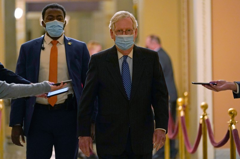 Senate Majority Leader Mitch McConnell of Ky., walks past reporters on Capitol Hill in Washington, Tuesday, Dec. 15, 2020. (AP Photo/Susan Walsh)