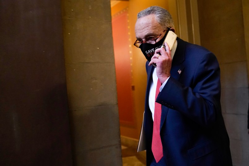 Senate Minority Leader Sen. Chuck Schumer of N.Y., walks on Capitol Hill in Washington, Tuesday, Dec. 15, 2020. (AP Photo/Susan Walsh)