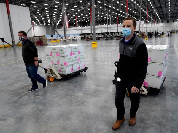 Boxes containing the Moderna COVID-19 vaccine are prepared to be shipped at the McKesson distribution center in Olive Branch, Miss., Sunday, Dec. 20. (AP Photo/Paul Sancya, Pool)
