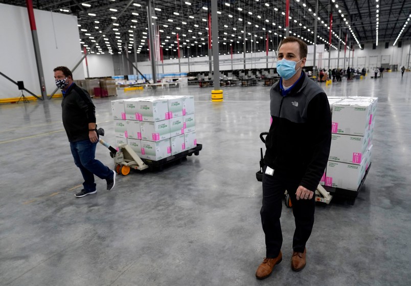 Boxes containing the Moderna COVID-19 vaccine are prepared to be shipped at the McKesson distribution center in Olive Branch, Miss., Sunday, Dec. 20. (AP Photo/Paul Sancya, Pool)