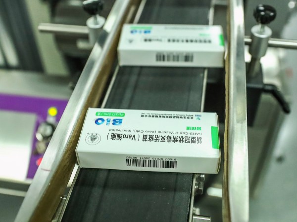 In this photo Dec. 25, 2020 released by Xinhua News Agency, packages of COVID-19 inactivated vaccine products are seen at a production plant of the Beijing Biological Products Institute Co., Ltd, a unit of state-owned Sinopharm in Beijing. The Chinese drugmaker said Wednesday, Dec. 30, 2020 its coronavirus vaccine was found to be 79.3% effective at preventing infection in preliminary data from the final round of testing, moving Beijing closer to possibly being able to fulfill its pledge to supply other developing countries.(Zhang Yuwei/Xinhua via AP)