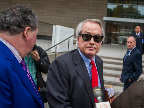 LOS ANGELES, CA - DECEMBER 03: British diver Vernon Unsworth; L, watches his attorneys; Mark Stephen; R, and L. Lin Wood; C, speaks to members of the media while they arrive at US District Court, Central District of California in Los Angeles, U.S. on December 3, 2019 in Los Angeles, California. The British diver sued the Tesla CEO Elon Musk over calling him "'Pedo Guy" and rapist. (Photo by Apu Gomes/Getty Images)