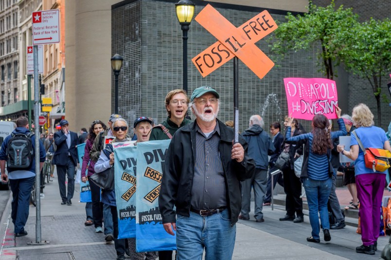 OFFICE OF THE NEW YORK STATE COMPTROLLER, NEW YORK, UNITED STATES - 2018/05/14: Fossil Free Divest NY, in coordination with community members and dozens of groups across America, held a rally outside the office of the New York State Comptroller in New York City, on May 14, 2018, to press NY State Comptroller Tom DiNapoli divest the state pension fund from its $6 billion in fossil fuel holdings, including $1 billion in ExxonMobil. (Photo by Erik McGregor/LightRocket via Getty Images)