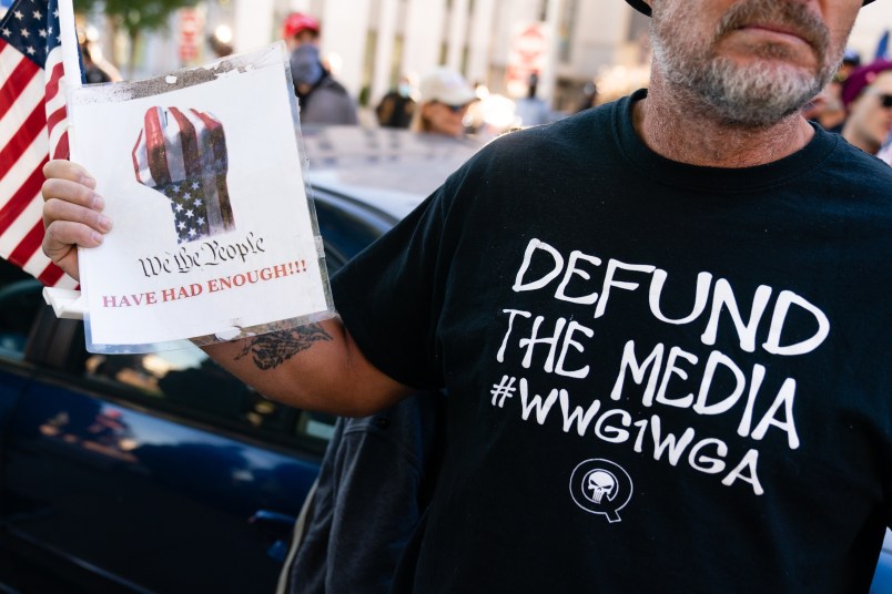 ATLANTA, GA - NOVEMBER 18: A man wearing a 'Defund the Media' QAnon shirt is seen at a "Stop the Steal" rally against the results of the U.S. Presidential election outside the Georgia State Capitol on November 18, 2020 in Atlanta, Georgia. (Photo by Elijah Nouvelage/Getty Images)