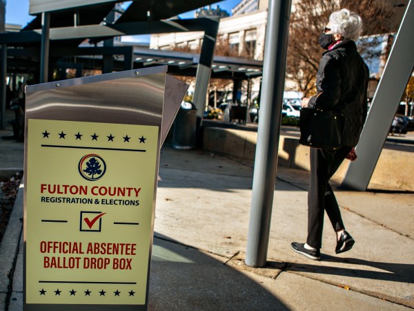 ATLANTA, GA - DECEMBER 14: A voter arrives at the Buckhead library in Atlanta on the first day of In-person early voting for the Georgia Senate runoff election on Monday, Dec. 14, 2020 in Atlanta, GA. (Jason Armond / Los Angeles Times)