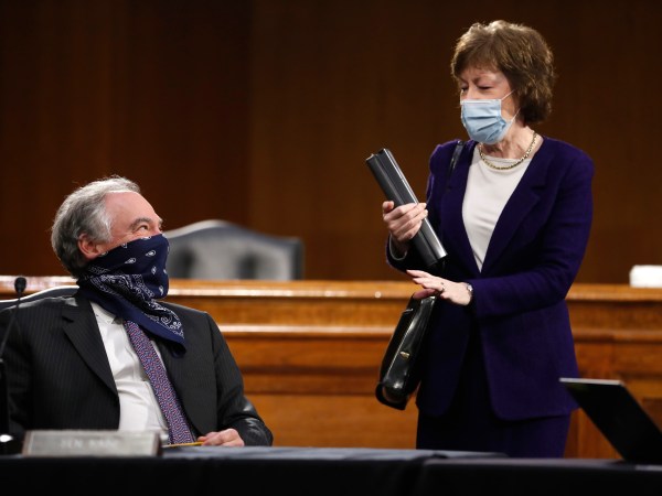 Sen. Tim Kaine, D-Va., speaks with Sen. Susan Collins, R-Maine, before a Senate Health Education Labor and Pensions Committee hearing on new coronavirus tests on Capitol Hill in Washington, Thursday, May 7, 2020. (AP Photo/Andrew Harnik, Pool)
