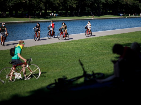 WASHINGTON, D.C., Aug. 31, 2020 -- People ride bicycles on the National Mall in Washington, D.C., the United States, Aug. 30, 2020. The number of COVID-19 cases in the United States reached 5,994,855 as of 9:28 p.m. EDT on Sunday, according to the Center for Systems Science and Engineering at Johns Hopkins University. (Photo by Ting Shen/Xinhua via Getty)