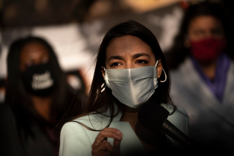 WASHINGTON, DC - NOVEMBER 19: Rep. Alexandria Ocasio-Cortez (D-NY) speaks outside of the Democratic National Committee headquarters on November 19, 2020 in Washington, DC. Ocasio-Cortez and others called on the incoming Joe Biden administration to take bold action on issues of climate change and economic inequalities. (Photo by Drew Angerer/Getty Images)