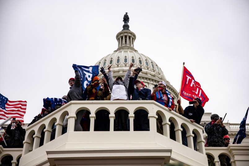WASHINGTON, DC - JANUARY 06: Pro-Trump supporters storm the US Capitol following a rally with President Donald Trump on January 6, 2021 in Washington, DC. Trump supporters gathered in the nation's capital today to protest the ratification of President-elect Joe Biden's Electoral College victory over President Trump in the 2020 election. (Photo by Samuel Corum/Getty Images)