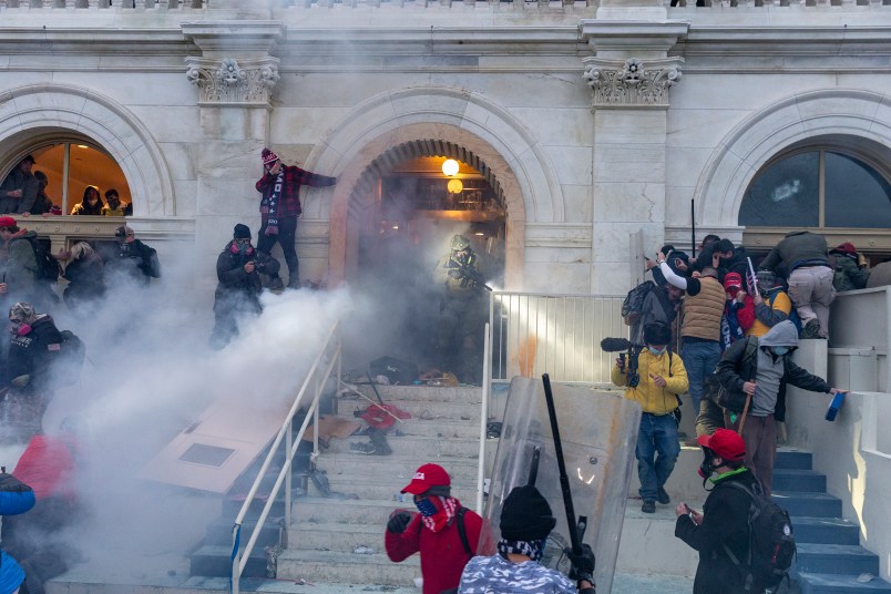 WASHINGTON DC, DISTRICT OF COLUMBIA, UNITED STATES - 2021/01/06: Police use tear gas around Capitol building where pro-Trump supporters riot and breached the Capitol. Rioters broke windows and breached the Capitol building in an attempt to overthrow the results of the 2020 election. Police used batons and tear gas grenades to eventually disperse the crowd. Rioters used metal bars and tear gas as well against the police. (Photo by Lev Radin/Pacific Press/LightRocket via Getty Images)