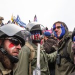 WASHINGTON DC, DISTRICT OF COLUMBIA, UNITED STATES - 2021/01/06: Pro-Trump protesters trying to enter Capitol building. Rioters broke windows and breached the Capitol building in an attempt to overthrow the results of the 2020 election. Police used batons and tear gas grenades to eventually disperse the crowd. Rioters used metal bars and tear gas as well against the police. (Photo by Lev Radin/Pacific Press/LightRocket via Getty Images)