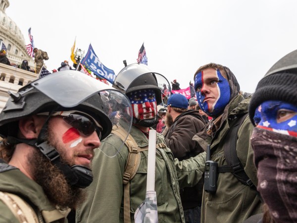 WASHINGTON DC, DISTRICT OF COLUMBIA, UNITED STATES - 2021/01/06: Pro-Trump protesters trying to enter Capitol building. Rioters broke windows and breached the Capitol building in an attempt to overthrow the results of the 2020 election. Police used batons and tear gas grenades to eventually disperse the crowd. Rioters used metal bars and tear gas as well against the police. (Photo by Lev Radin/Pacific Press/LightRocket via Getty Images)