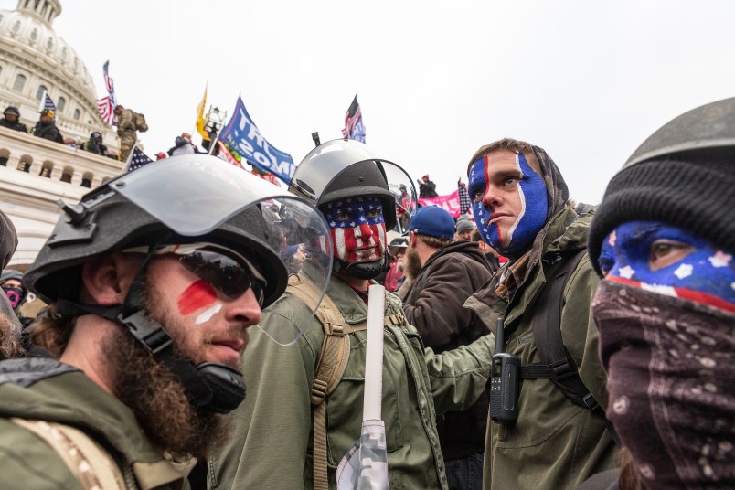 WASHINGTON DC, DISTRICT OF COLUMBIA, UNITED STATES - 2021/01/06: Pro-Trump protesters trying to enter Capitol building. Rioters broke windows and breached the Capitol building in an attempt to overthrow the results of the 2020 election. Police used batons and tear gas grenades to eventually disperse the crowd. Rioters used metal bars and tear gas as well against the police. (Photo by Lev Radin/Pacific Press/LightRocket via Getty Images)