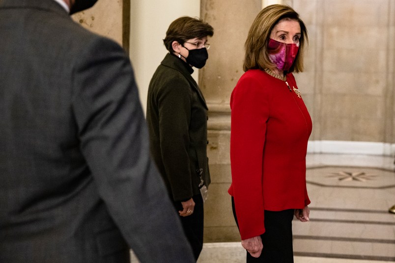 WASHINGTON, DC - JANUARY 25: Speaker of the House Nancy Pelosi (D-CA) heads back to her office after calling the House of Representatives into a pro forma session on January 25, 2021 in Washington, DC. Later today the House will be sending the Articles of Impeach meant of former President Donald Trump to the Senate which will trigger the start of the trial. (Photo by Samuel Corum/Getty Images) *** Local Caption *** Nancy Pelosi