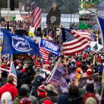 WASHINGTON, DC - JANUARY 06: President Donald Trump is seen on a screen as his supporters cheer during a rally on the National Mall on January 6, 2021 in Washington, DC. Trump supporters gathered in the nation's capital today to protest the ratification of President-elect Joe Biden's Electoral College victory over President Trump in the 2020 election. (Photo by Samuel Corum/Getty Images) *** Local Caption *** Donald Trump