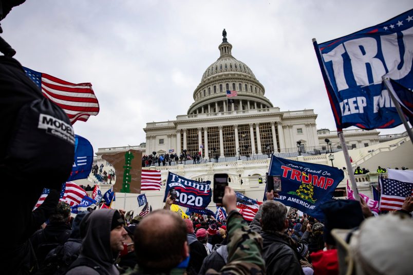 WASHINGTON, DC - JANUARY 06: Pro-Trump supporters storm the US Capitol following a rally with President Donald Trump on January 6, 2021 in Washington, DC. Trump supporters gathered in the nation's capital today to protest the ratification of President-elect Joe Biden's Electoral College victory over President Trump in the 2020 election. (Photo by Samuel Corum/Getty Images)