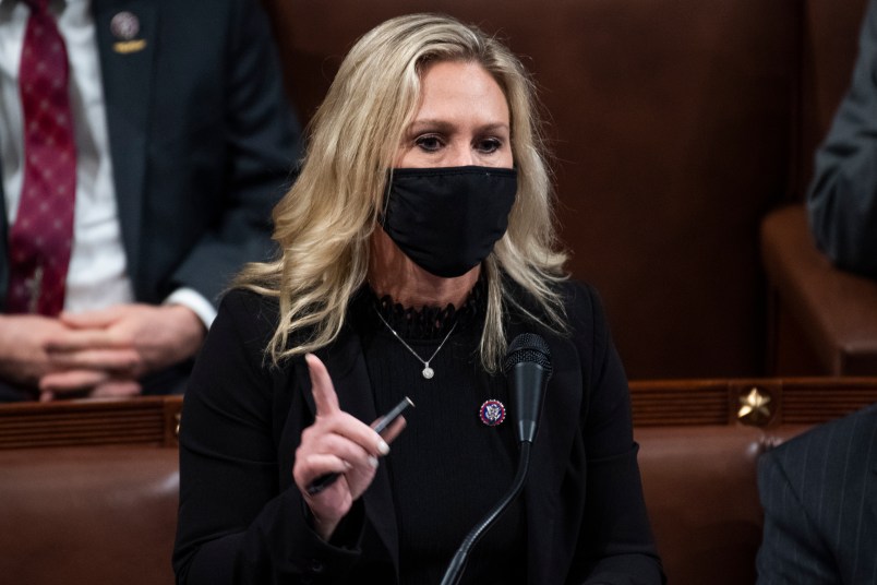 UNITED STATES - JANUARY 7: Rep. Marjorie Taylor Greene, R-Ga., objects to Michigan’s Electoral College votes during a joint session of Congress to certify the 2020 presidential election in the House chamber on Thursday, January 7, 2021. (Photo By Tom Williams/CQ Roll Call)