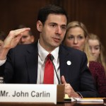 WASHINGTON, DC - JANUARY 08:  Acting Assistant Attorney General for National Security at the Department of Justice John Carlin testifies as his wife Sarah listens during his confirmation hearing before the Senate Judiciary Committee January 8, 2014 on Capitol Hill in Washington, DC. Carlin has been nominated by President Barack Obama to become the next Assistant Attorney General for National Security at the Department of Justice.  (Photo by Alex Wong/Getty Images)