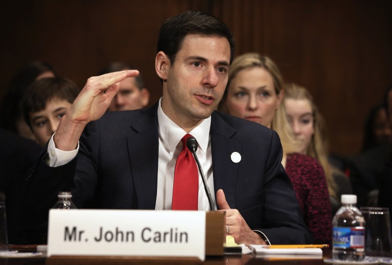 WASHINGTON, DC - JANUARY 08:  Acting Assistant Attorney General for National Security at the Department of Justice John Carlin testifies as his wife Sarah listens during his confirmation hearing before the Senate Judiciary Committee January 8, 2014 on Capitol Hill in Washington, DC. Carlin has been nominated by President Barack Obama to become the next Assistant Attorney General for National Security at the Department of Justice.  (Photo by Alex Wong/Getty Images)