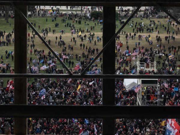 WASHINGTON, DC - JANUARY 06: A crowd of Trump supporters gather outside as seen from inside the U.S. Capitol on January 6, 2021 in Washington, DC. Congress will hold a joint session today to ratify President-elect Joe Biden's 306-232 Electoral College win over President Donald Trump. The joint session was disrupted as the Trump supporters breached the Capitol building. (Photo by Cheriss May/Getty Images)