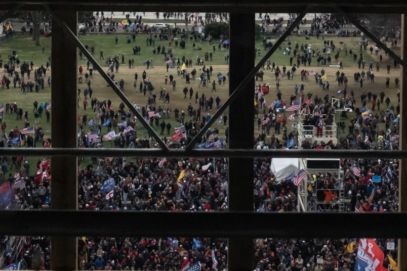 WASHINGTON, DC - JANUARY 06: A crowd of Trump supporters gather outside as seen from inside the U.S. Capitol on January 6, 2021 in Washington, DC. Congress will hold a joint session today to ratify President-elect Joe Biden's 306-232 Electoral College win over President Donald Trump. The joint session was disrupted as the Trump supporters breached the Capitol building. (Photo by Cheriss May/Getty Images)