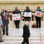 ATLANTA, GA - MARCH 08: Demonstrators hold a “sit in” inside of the Capitol building in opposition of House Bill 531 on March 8, 2021 in Atlanta, Georgia. HB531 will restrict early voting hours, remove drop boxes, and require the use of a government ID when voting by mail.  (Photo by Megan Varner/Getty Images)