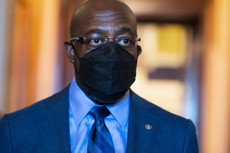 UNITED STATES - MARCH 23: Sen. Raphael Warnock, D-Ga., is seen during a Senate vote in the Capitol on Tuesday, March 23, 2021. (Photo By Tom Williams/CQ Roll Call)