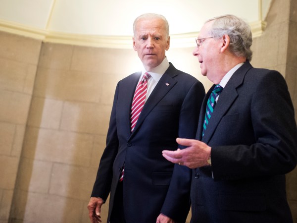 UNITED STATES - JANUARY 12: Vice President Joe Biden, left, and Senate Majority Leader Mitch McConnell, R-Ky., make their way to the House floor for President Obama's State of the Union address, January 12, 2016. (Photo By Tom Williams/CQ Roll Call)