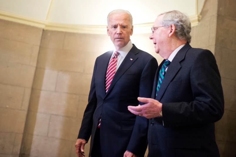 UNITED STATES - JANUARY 12: Vice President Joe Biden, left, and Senate Majority Leader Mitch McConnell, R-Ky., make their way to the House floor for President Obama's State of the Union address, January 12, 2016. (Photo By Tom Williams/CQ Roll Call)