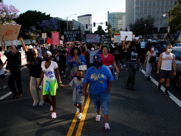 LOS ANGELES, CA - MAY 27: People take to the streets during a Black Lives Matter protest in downtown  on Wednesday, May 27, 2020 in Los Angeles, CA. Several hundred protesters, many in masks, converged on downtown as part of a series of national outrage over the death of George Floyd. (Dania Maxwell / Los Angeles Times)