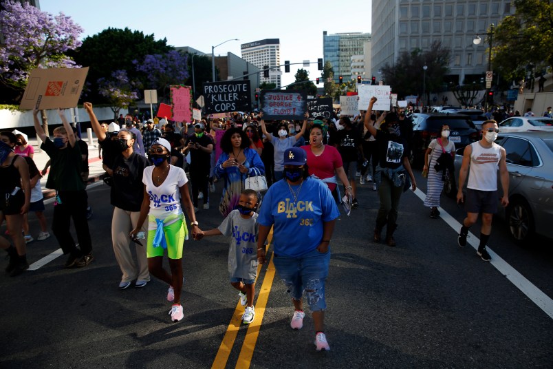 LOS ANGELES, CA - MAY 27: People take to the streets during a Black Lives Matter protest in downtown  on Wednesday, May 27, 2020 in Los Angeles, CA. Several hundred protesters, many in masks, converged on downtown as part of a series of national outrage over the death of George Floyd. (Dania Maxwell / Los Angeles Times)