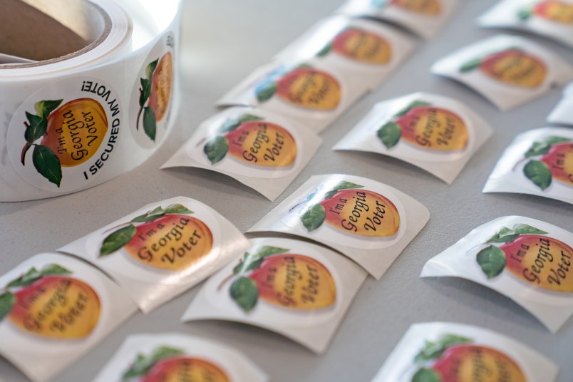 ATLANTA, GA - JANUARY 05: Stickers for voters after they have voted, sit on a table at a Cobb County voting location on January 5, 2021 in Atlanta, Georgia. Polls have opened across Georgia in the two runoff elections, pitting incumbents Sen. David Perdue (R-GA) and Sen. Kelly Loeffler (R-GA) against Democratic candidates Rev. Raphael Warnock and Jon Ossoff. (Photo by Megan Varner/Getty Images)