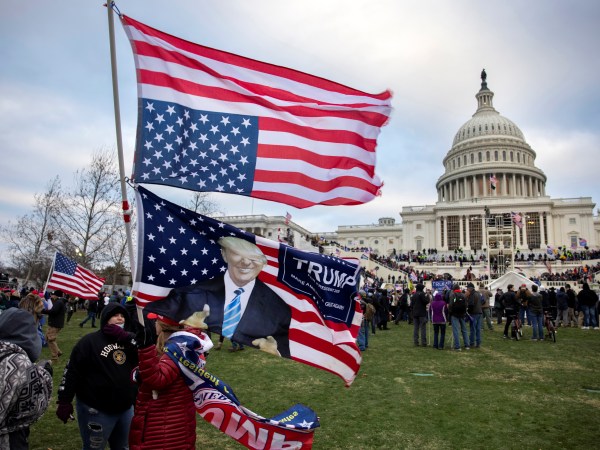 nation's capital to protest the ratification of President-elect Joe Biden's Electoral College victory over President Trump in the 2020 election. A pro-Trump mob later stormed the Capitol, breaking windows and clashing with police officers. Five people died as a result.  (Photo by Brent Stirton/Getty Images)