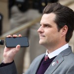 CHEYENNE, WY - JANUARY 28: Rep. Matt Gaetz (R-FL) holds a phone to the microphone as Donald Trump Jr. speaks remotely to a crowd during a rally against Rep. Liz Cheney (R-WY) on January 28, 2021 in Cheyenne, Wyoming. Gaetz and Trump Jr. added their voices to a growing effort to vote Cheney out of office after she voted in favor of impeaching Donald Trump. (Photo by Michael Ciaglo/Getty Images)