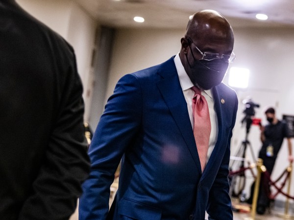 WASHINGTON, DC - FEBRUARY 13: Senator Raphael Warnock (D-GA) walks through the Senate subway before the start of the fourth day in the Senates second impeachment trial of former President Donald Trump on February 13, 2021 in Washington, DC. The Senate voted 55-45 in favor of calling witnesses in the trial to decide on if Trump should or should not be held responsible for the January 6th attack at the U.S. Capitol. (Photo by Samuel Corum/Getty Images) *** Local Caption *** Raphael Warnock