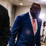 WASHINGTON, DC - FEBRUARY 13: Senator Raphael Warnock (D-GA) walks through the Senate subway before the start of the fourth day in the Senates second impeachment trial of former President Donald Trump on February 13, 2021 in Washington, DC. The Senate voted 55-45 in favor of calling witnesses in the trial to decide on if Trump should or should not be held responsible for the January 6th attack at the U.S. Capitol. (Photo by Samuel Corum/Getty Images) *** Local Caption *** Raphael Warnock