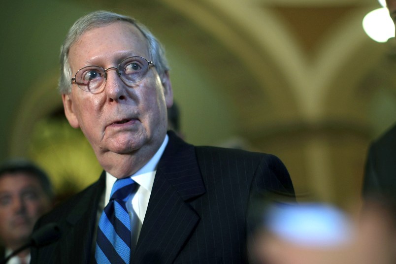 WASHINGTON, DC - JULY 11:  U.S. Senate Majority Leader Sen. Mitch McConnell (R-KY) listens during a news briefing after the weekly Senate Republican Policy Luncheon July 11, 2017 at the Capitol in Washington, DC. Sen. McConnell announced that Senate will delay its recess to the third week of August.  (Photo by Alex Wong/Getty Images)