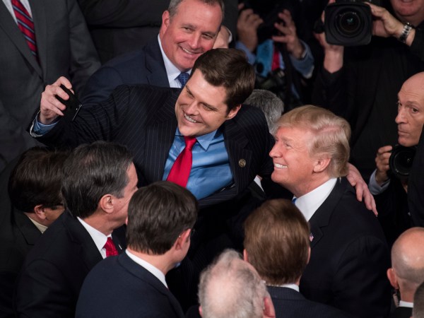 UNITED STATES - JANUARY 30: President Donald Trump takes a selfie with Rep. Matt Gaetz, R-Fla., in the House chamber after Trump's State of the Union address to a joint session of Congress on January 30, 2018. (Photo By Tom Williams/CQ Roll Call)