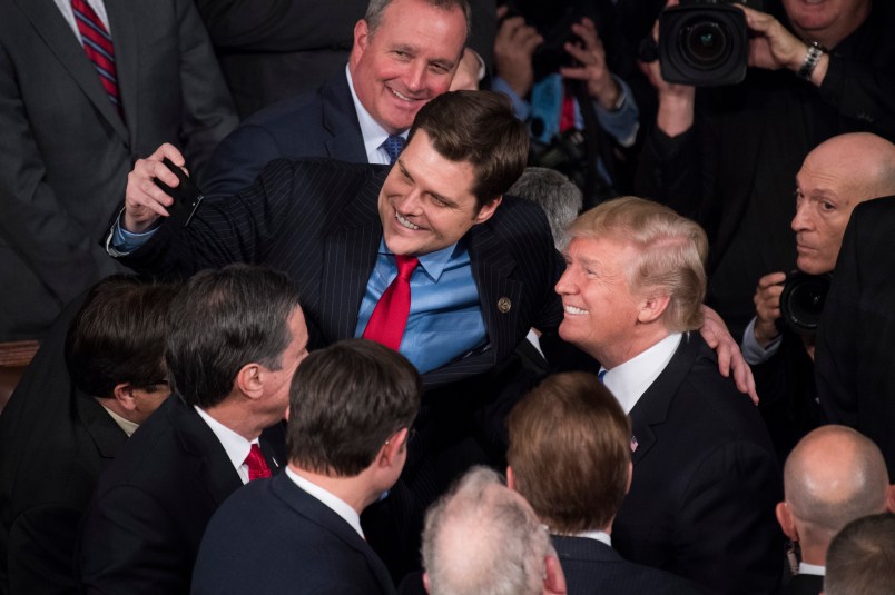 UNITED STATES - JANUARY 30: President Donald Trump takes a selfie with Rep. Matt Gaetz, R-Fla., in the House chamber after Trump's State of the Union address to a joint session of Congress on January 30, 2018. (Photo By Tom Williams/CQ Roll Call)