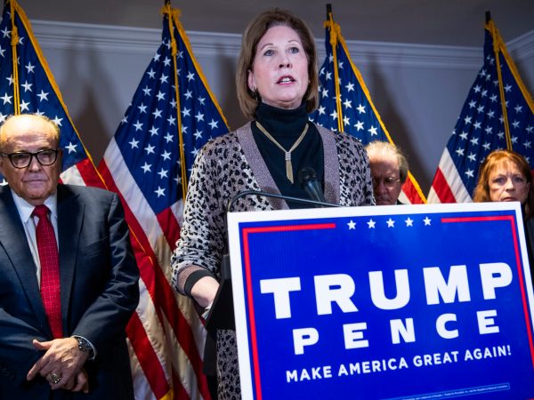 UNITED STATES - NOVEMBER 19: Sidney Powell, attorney for President Donald Trump, conducts a news conference at the Republican National Committee on lawsuits regarding the outcome of the 2020 presidential election on Thursday, November 19, 2020. Trump attorney Rudolph Giuliani, left, also attended. (Photo By Tom Williams/CQ Roll Call)